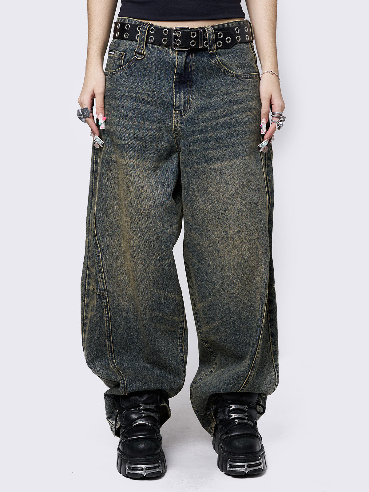 Blue washed super baggy jeans with green overdye, a relaxed fit, regular waist, zip fly, button fastening, and belt loops. Trendy streetwear style.