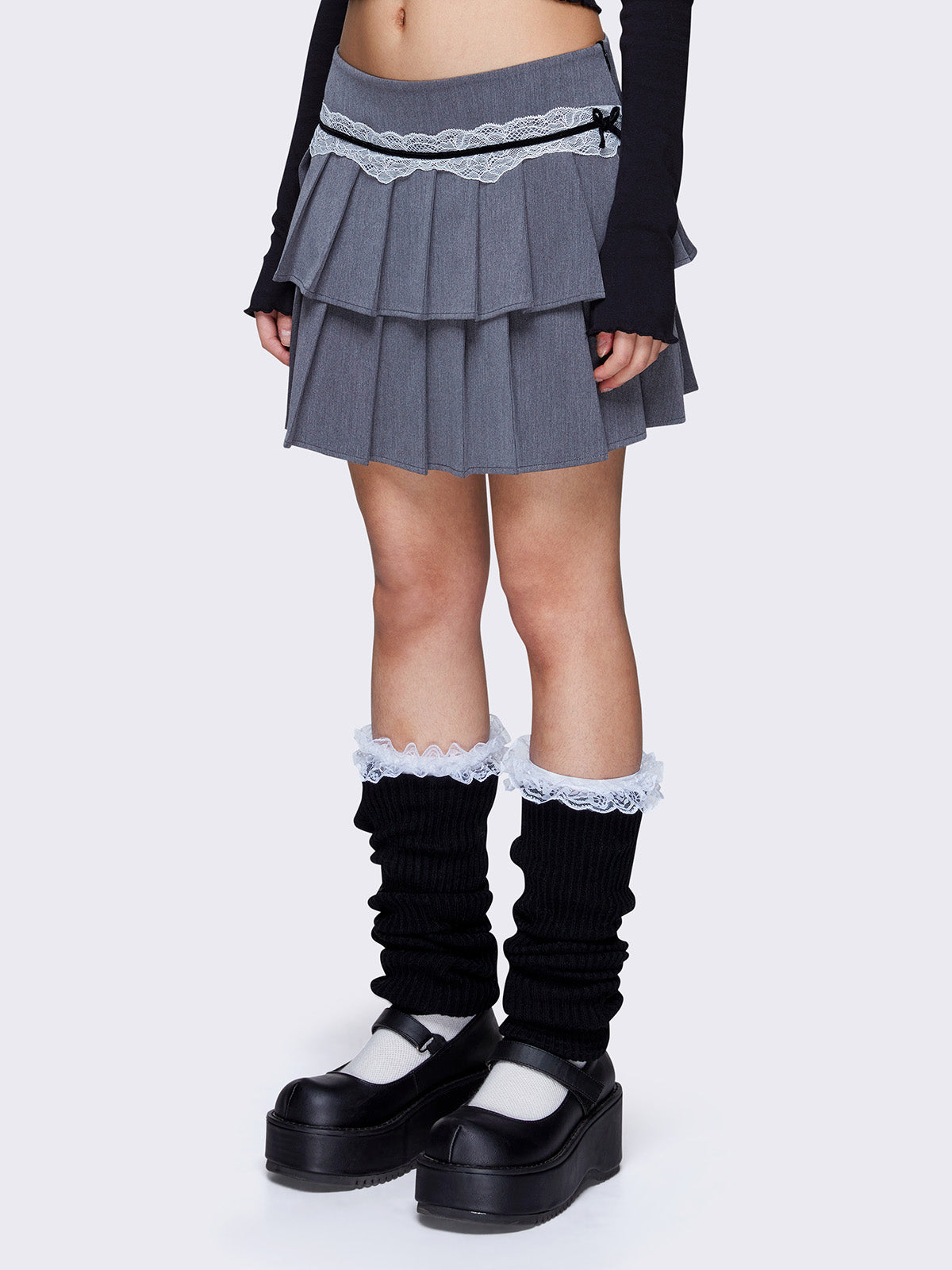 Layered pleated mini skirt in grey with white lace and black velvet trim, low waist, and invisible side zipper.