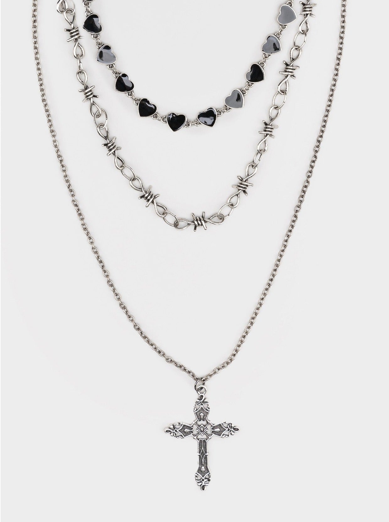 Set of 3 necklaces with heart, thorns chains and cross pendant