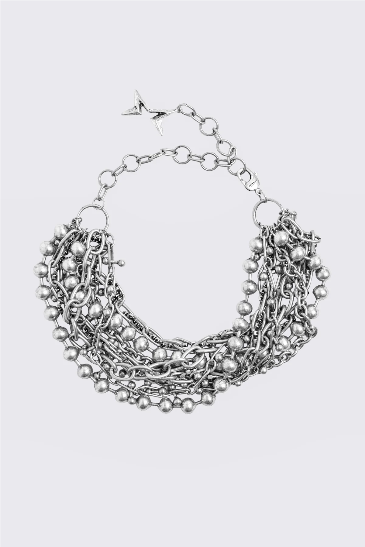 Silver layered chain collar necklace with mixed ball and curb chain strands and chunky multi-strand detail.