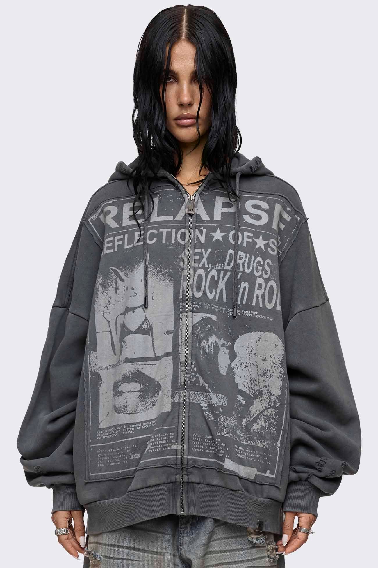 Grey washed zip up hoodie with Relapse graphic print, distressed details and oversized fit on model.