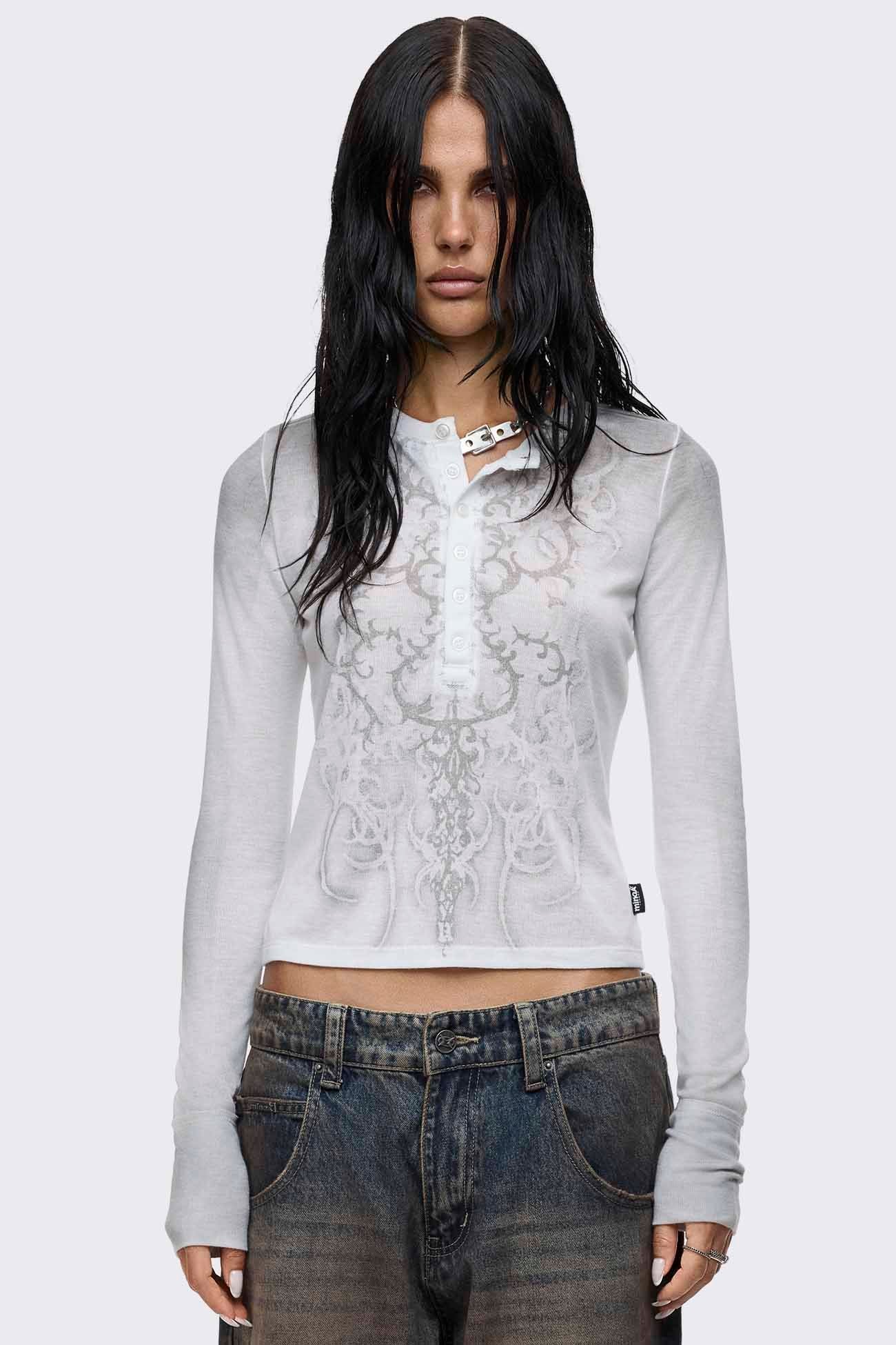 Off-white washed long sleeve henley top with sigilism graphic print, button placket, cropped length and slim fit.
