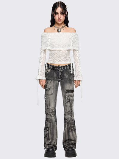 Off shoulder top in white lace construction. Bardot fold-over neck, lace up details and long flared sleeves.