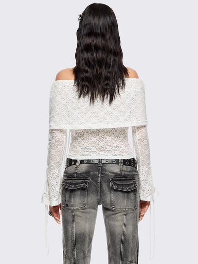 Off shoulder top in white lace construction. Bardot fold-over neck, lace up details and long flared sleeves.