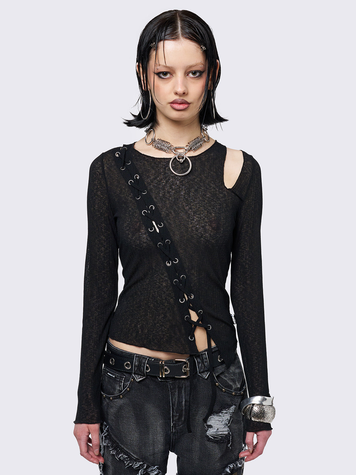 Asymmetric top in black with lace up and cut out detail. Grunge vibe. 