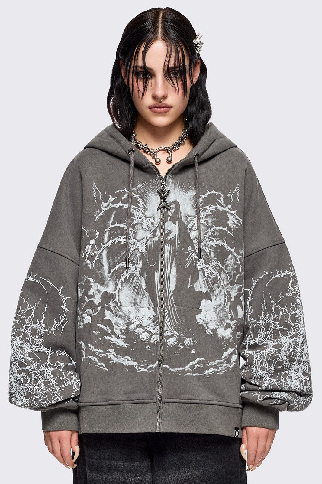 Grey zip up hoodie jacket featuring a sacred figure graphic on front and thorn sleeve prints.