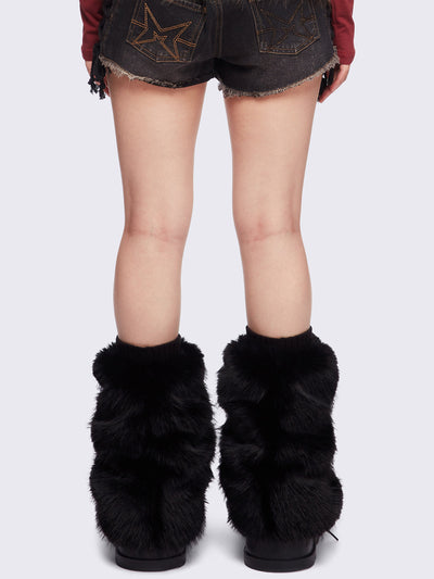 Black faux fur flared leg warmers with pom pom drawstring.