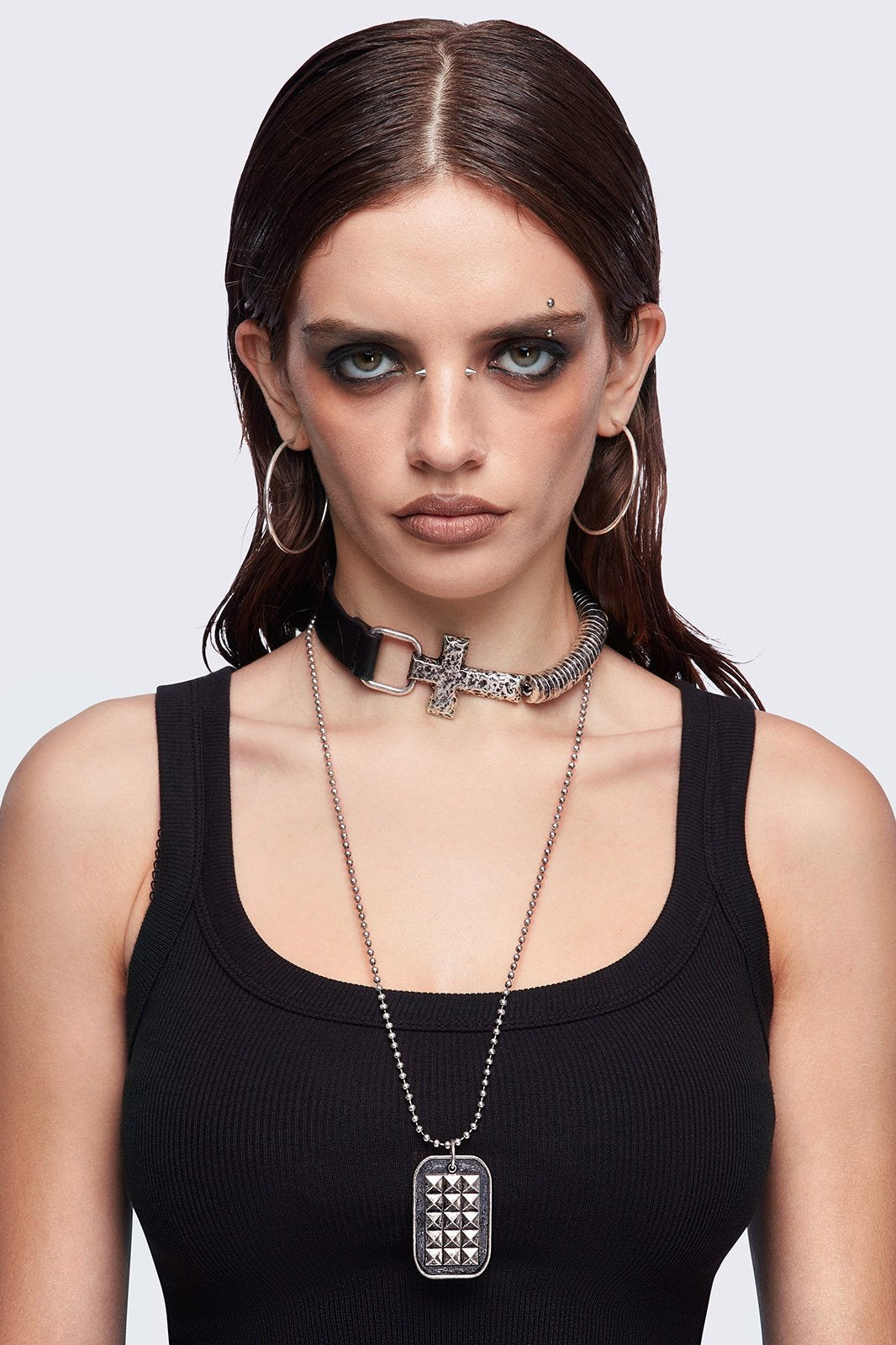 Set of 2 necklaces: Black faux leather choker with a cross buckle detail and a long ball chain necklace with dog-tag style pendant.
