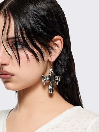 Pair of silver cross-shaped earrings with embedded stones 