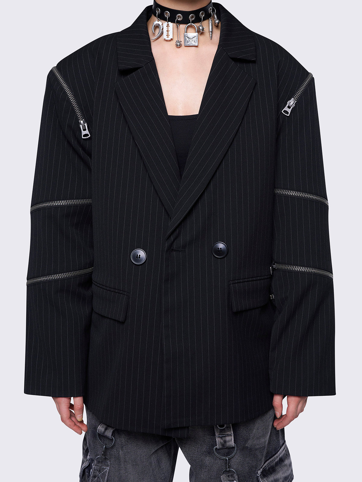 Blazer in black pinstripes with zipper details