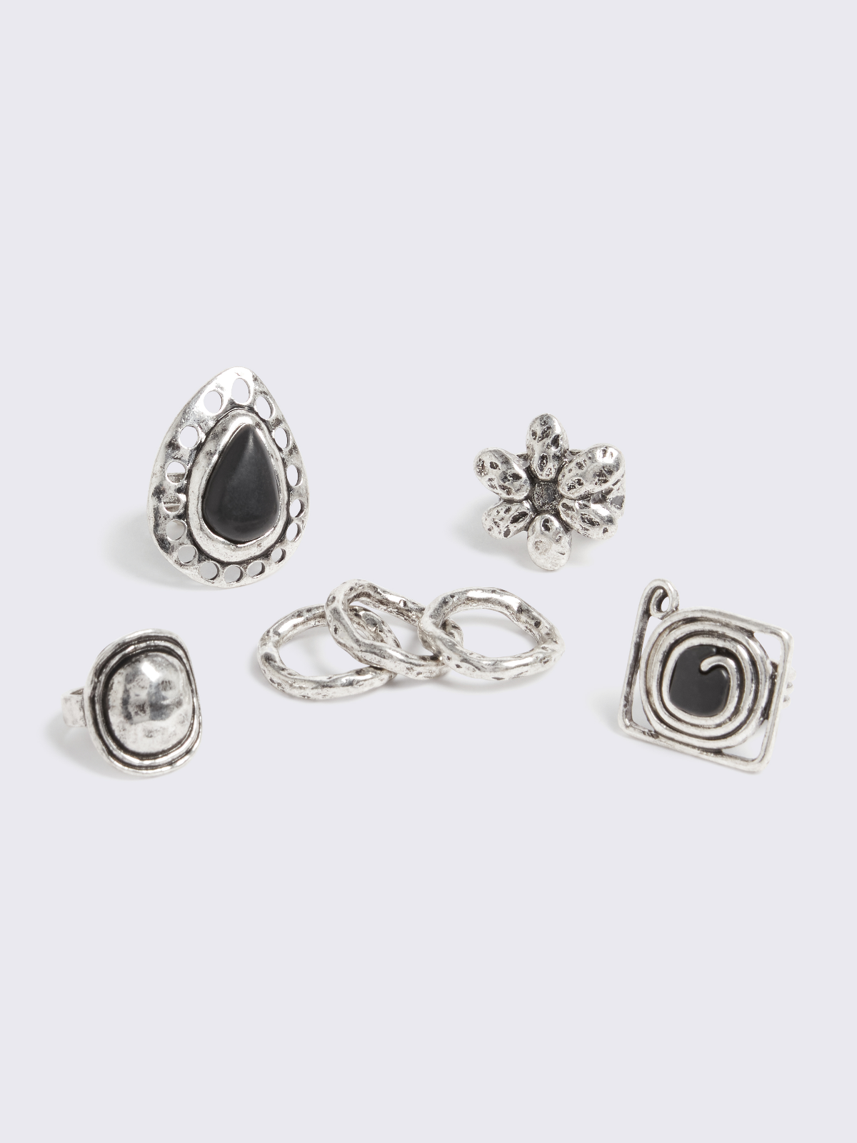 Set of 5 silver rings with mix engraved designs featuring black stones and slim and chunky bands.