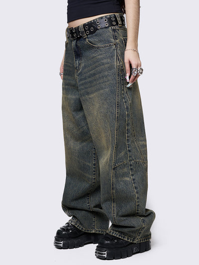 Blue washed super baggy jeans with green overdye, a relaxed fit, regular waist, zip fly, button fastening, and belt loops. Trendy streetwear style.