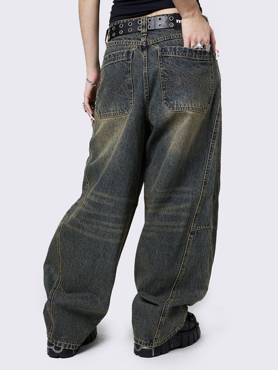 Blue washed super baggy jeans with green overdye, a relaxed fit, regular waist, zip fly, button fastening, and belt loops. Trendy streetwear style.