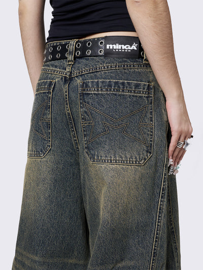 Blue washed super baggy jeans with green overdye, a relaxed fit, regular waist, zip fly, button fastening, and belt loops. Trendy streetwear style.
