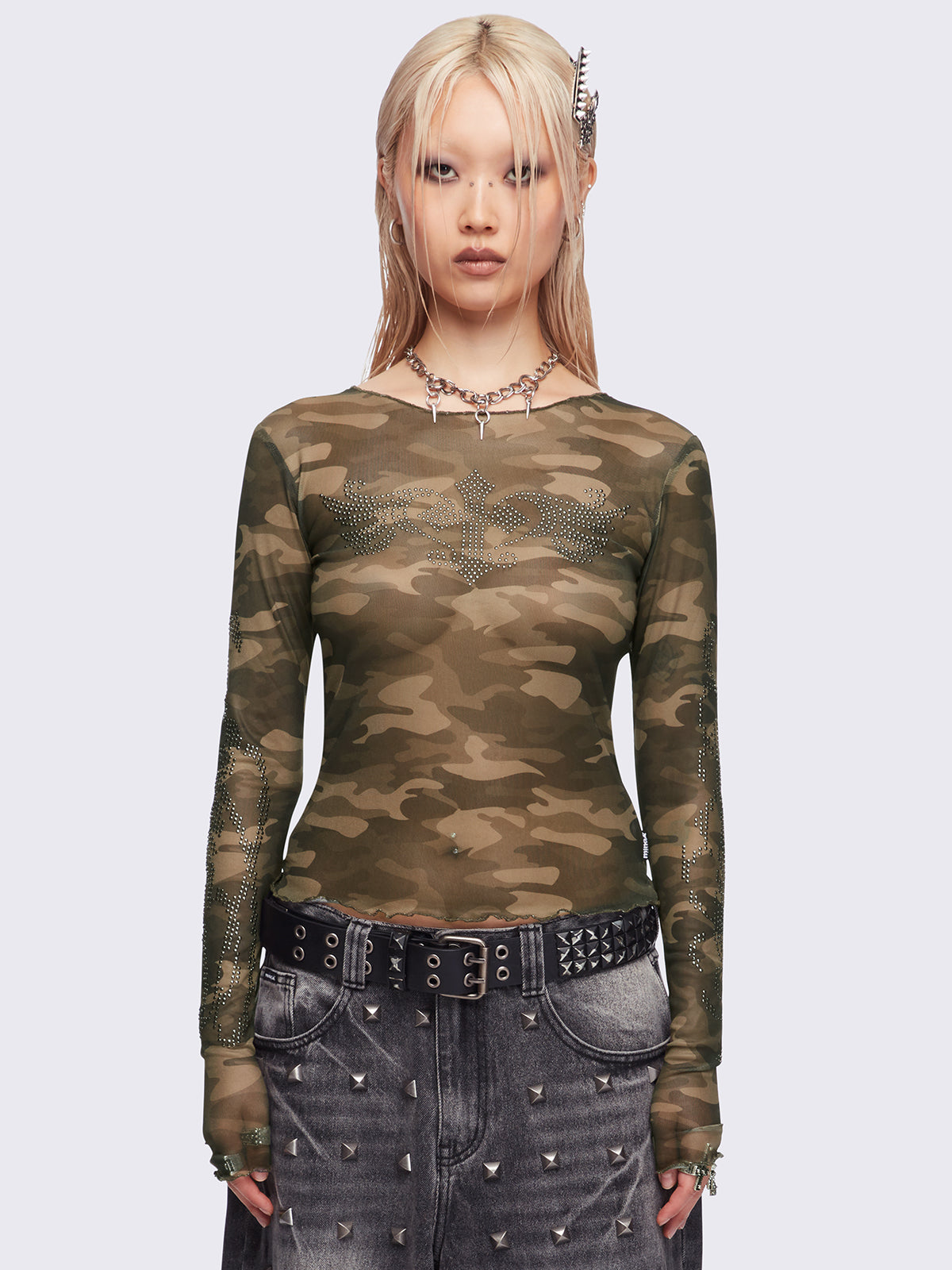 Camo printed mesh top with winged cross and rhinestone details.