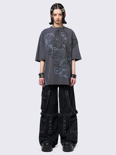 Grey washed t-shirt with grunge graphic front print featuring studded details. 