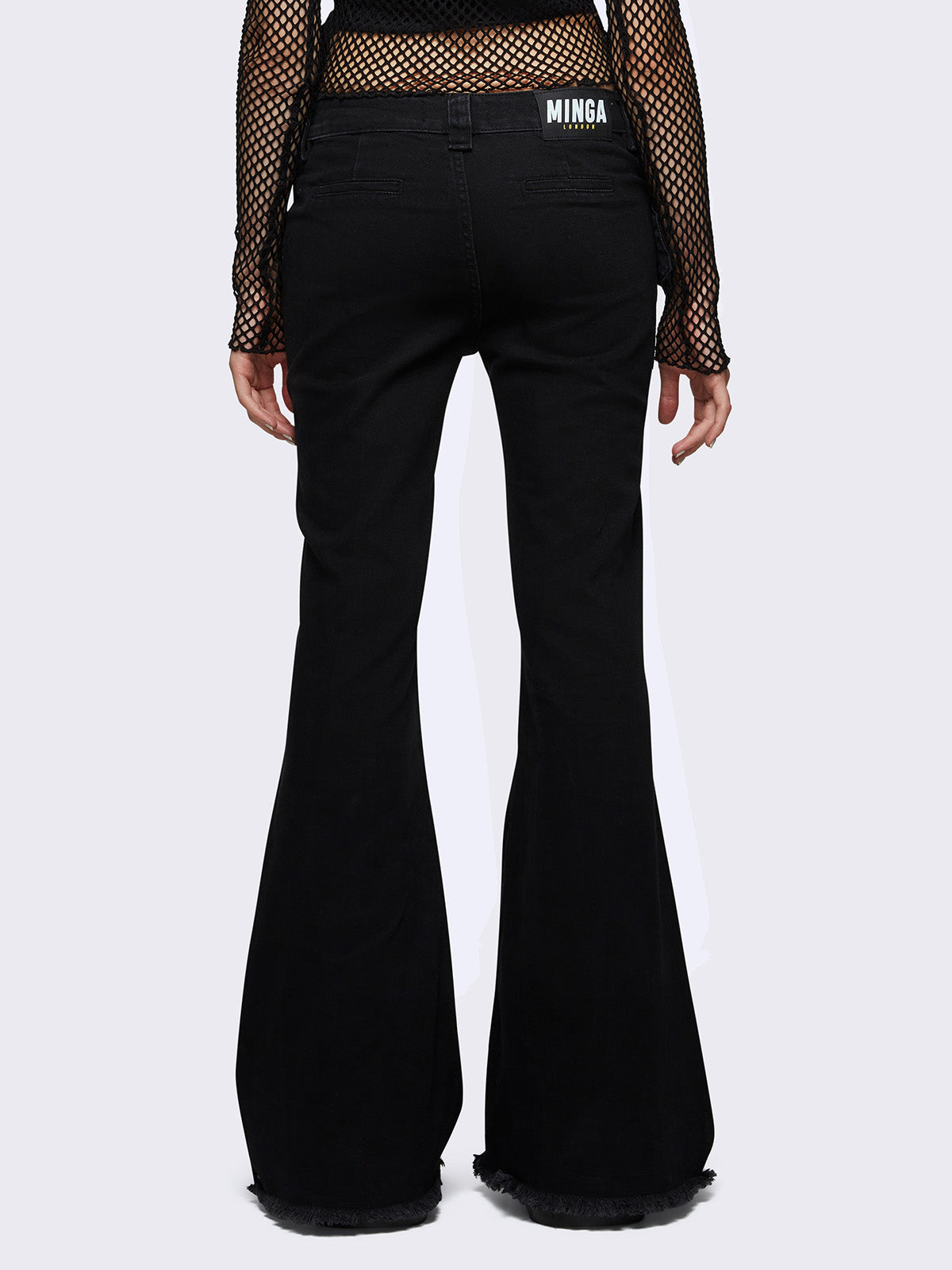 Flared jeans in black with chunky buckle belt