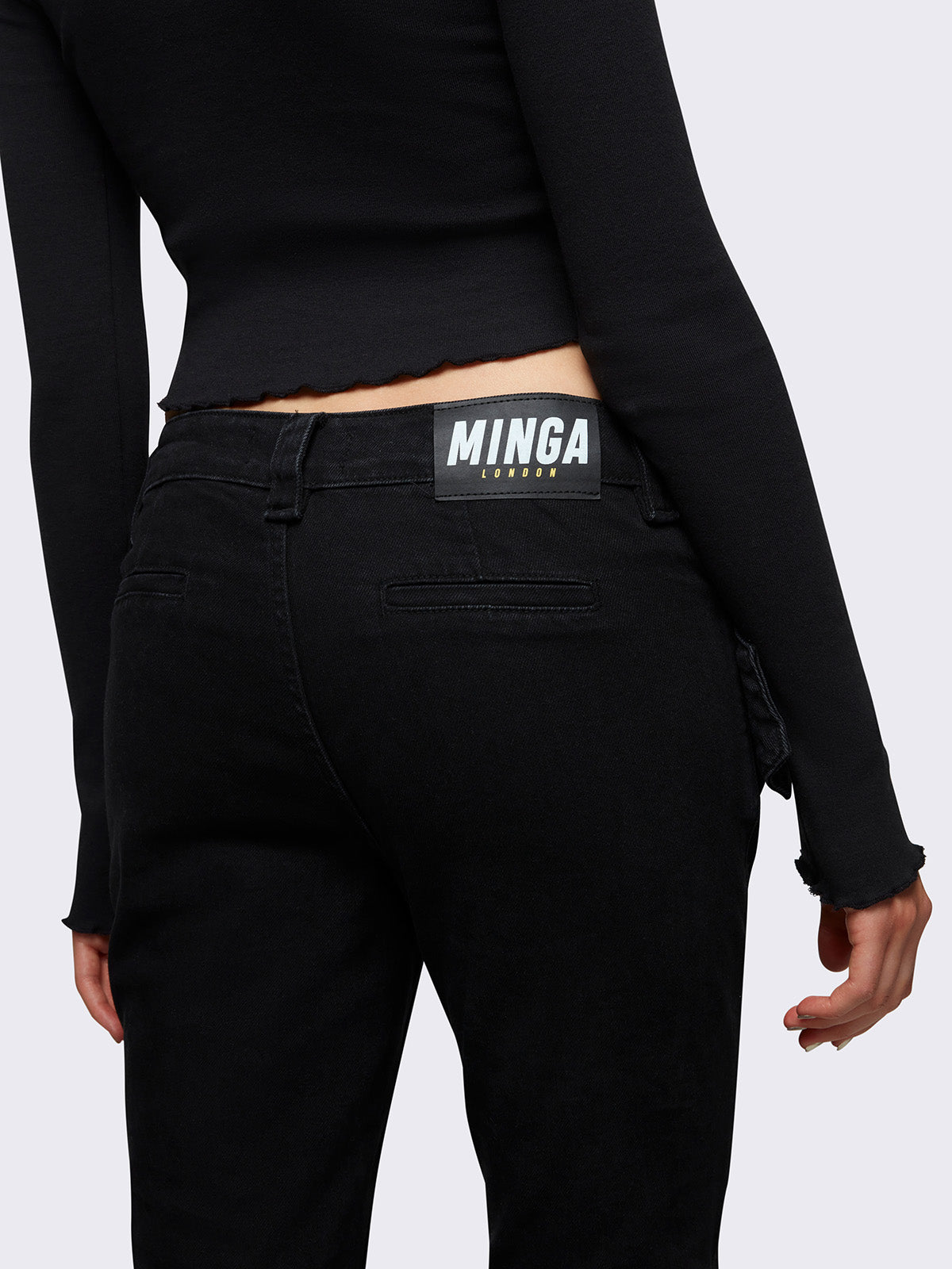 Flared jeans in black with chunky buckle belt