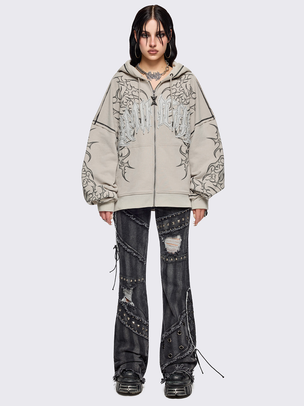 Bone beige zip up hoodie jacket featuring a black tribal sigilism graphic front and sleeves print, "Minga" embroidered patch and black contrast stitching.