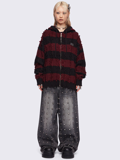 Hooded chunky knit cardigan in black and red stripes with distressed details.