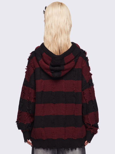 Hooded chunky knit cardigan in black and red stripes with distressed details.