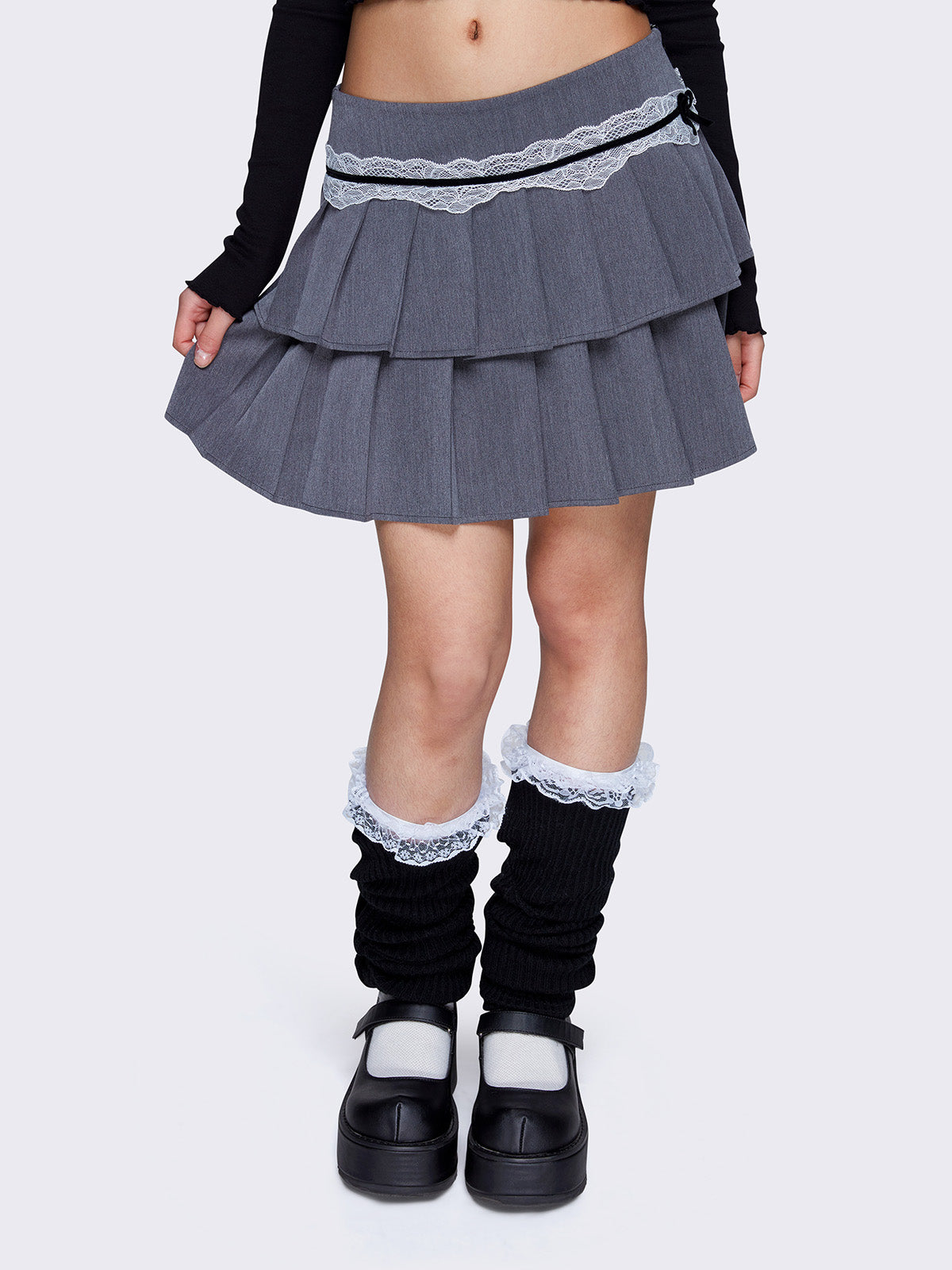Layered pleated mini skirt in grey with white lace and black velvet trim, low waist, and invisible side zipper.