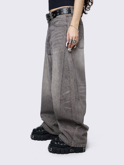 Grey washed super baggy jeans with a relaxed fit, regular waist, zip fly, button fastening, and belt loops. Trendy streetwear style.