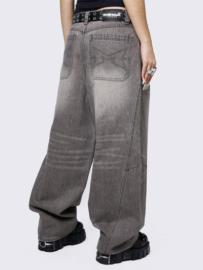Grey washed super baggy jeans with a relaxed fit, regular waist, zip fly, button fastening, and belt loops. Trendy streetwear style.