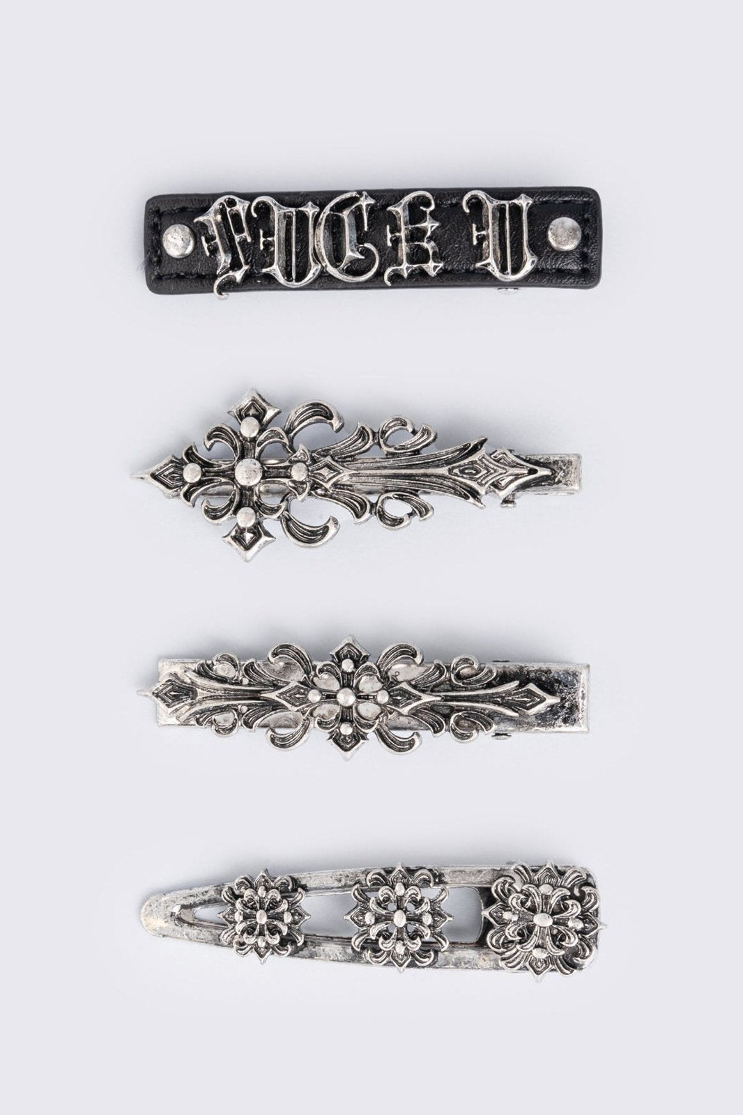Set of 4 hair clips with silver floral baroque and black PU.