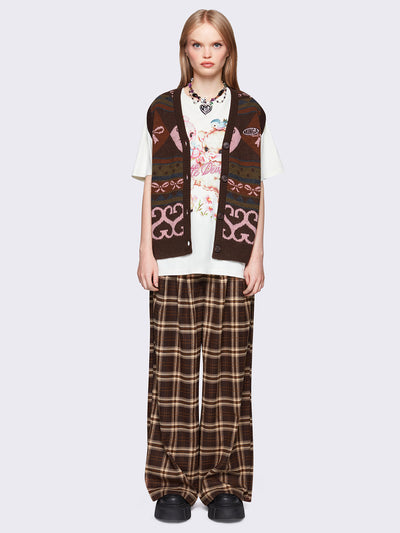 Jacquard knit sweater vest in brown with geometric striped pattern and bows design