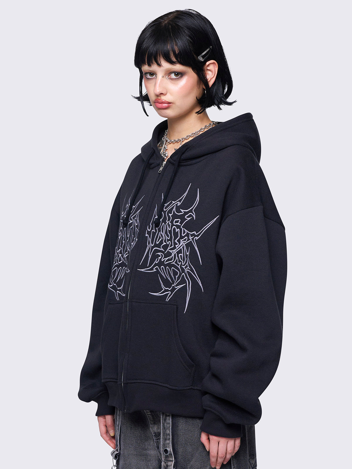 Zip up hoodie jacket in black with Sigilism graphic front embroidery and Drawstring hood.