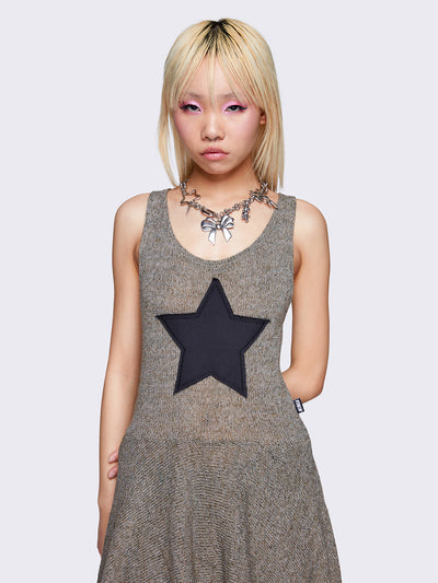 Khaki green sleeveless knitted dress with a black star front patch, featuring a mini asymmetrical length for a stylish and unique look.