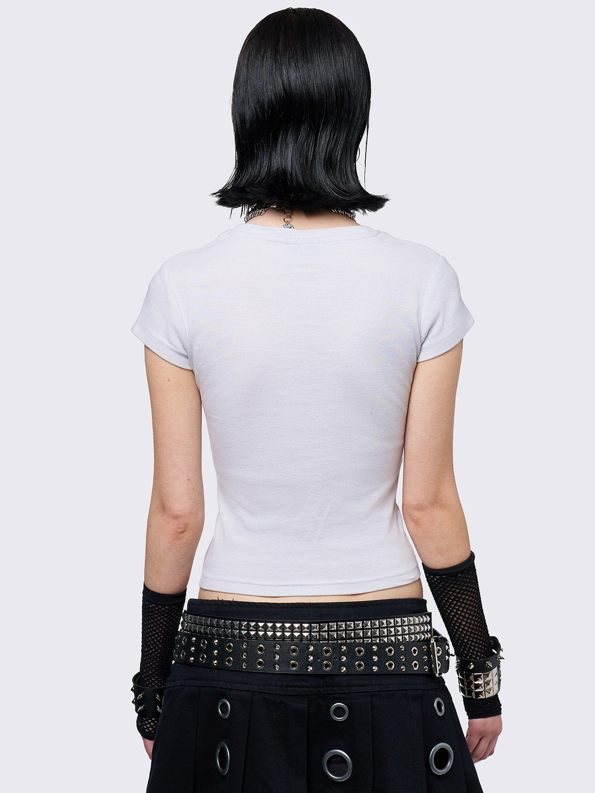 Off-white graphic baby tee with boobs print and nipple piercing details.