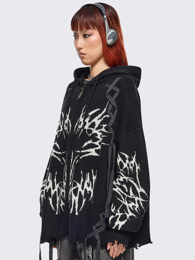 Black hooded chunky knit cardigan featuring white sigilism graphic design, contrast grey lace up details and distressed trims.