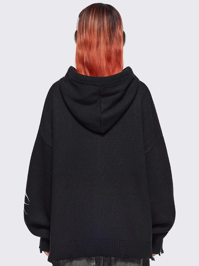 Black hooded chunky knit cardigan featuring white sigilism graphic design, contrast grey lace up details and distressed trims.