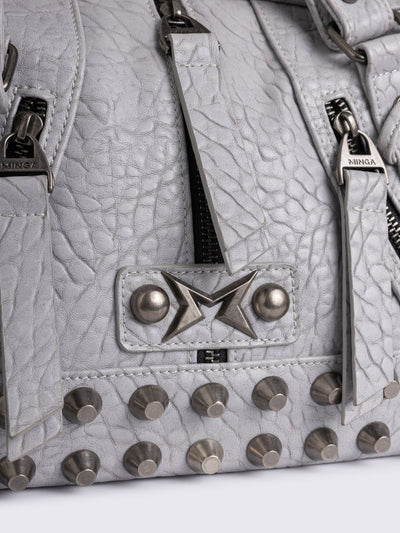 White faux leather shoulder bag with stud, lace up and metal hardware details