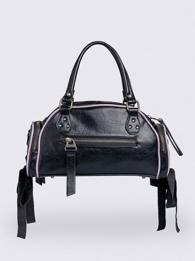 Black bowling bag with white wings graphic print, 3D cross metal stud and side exterior pockets with lace up bows.