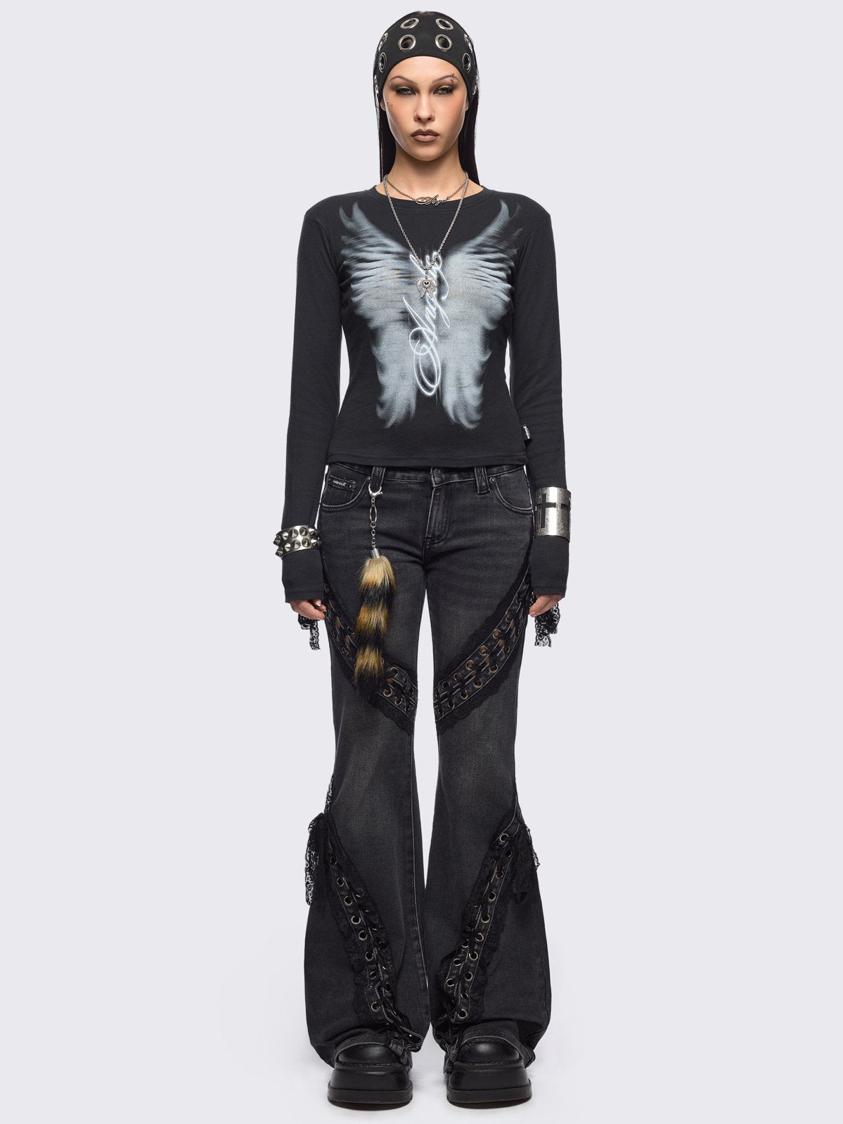 Black long sleeve top featuring an angelic wings graphic front print.