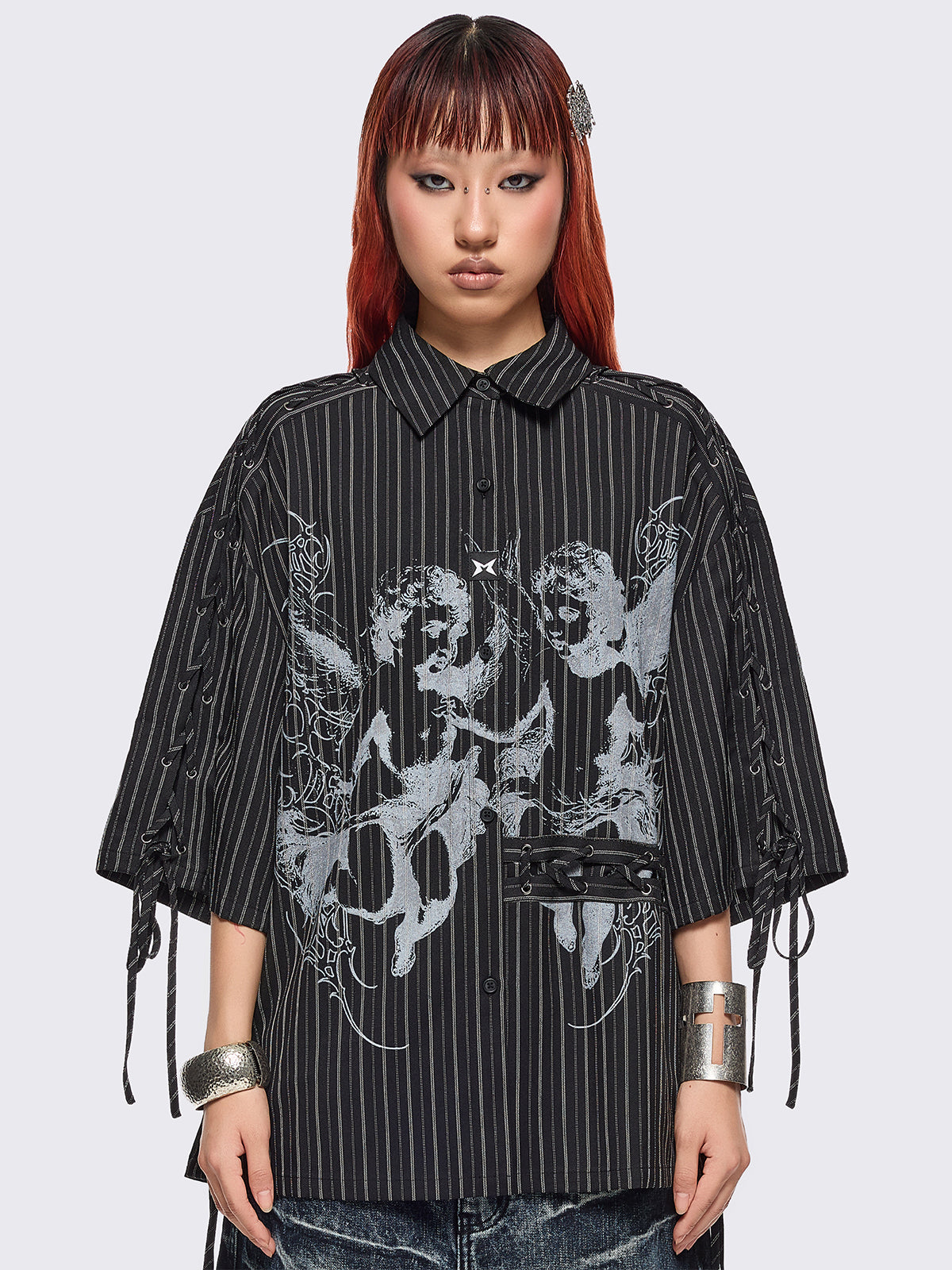 Black pinstriped shirt with white angels graphic front print and laced up details.