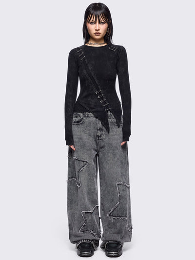 Black washed asymmetric top with cut-out and safety pin details.