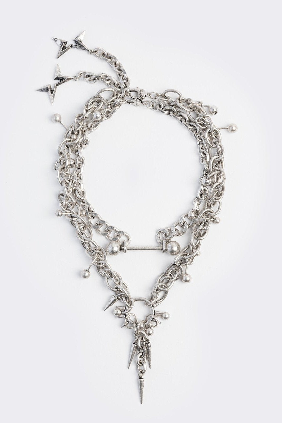 Set of 2 silver necklaces with spike and piercing details 