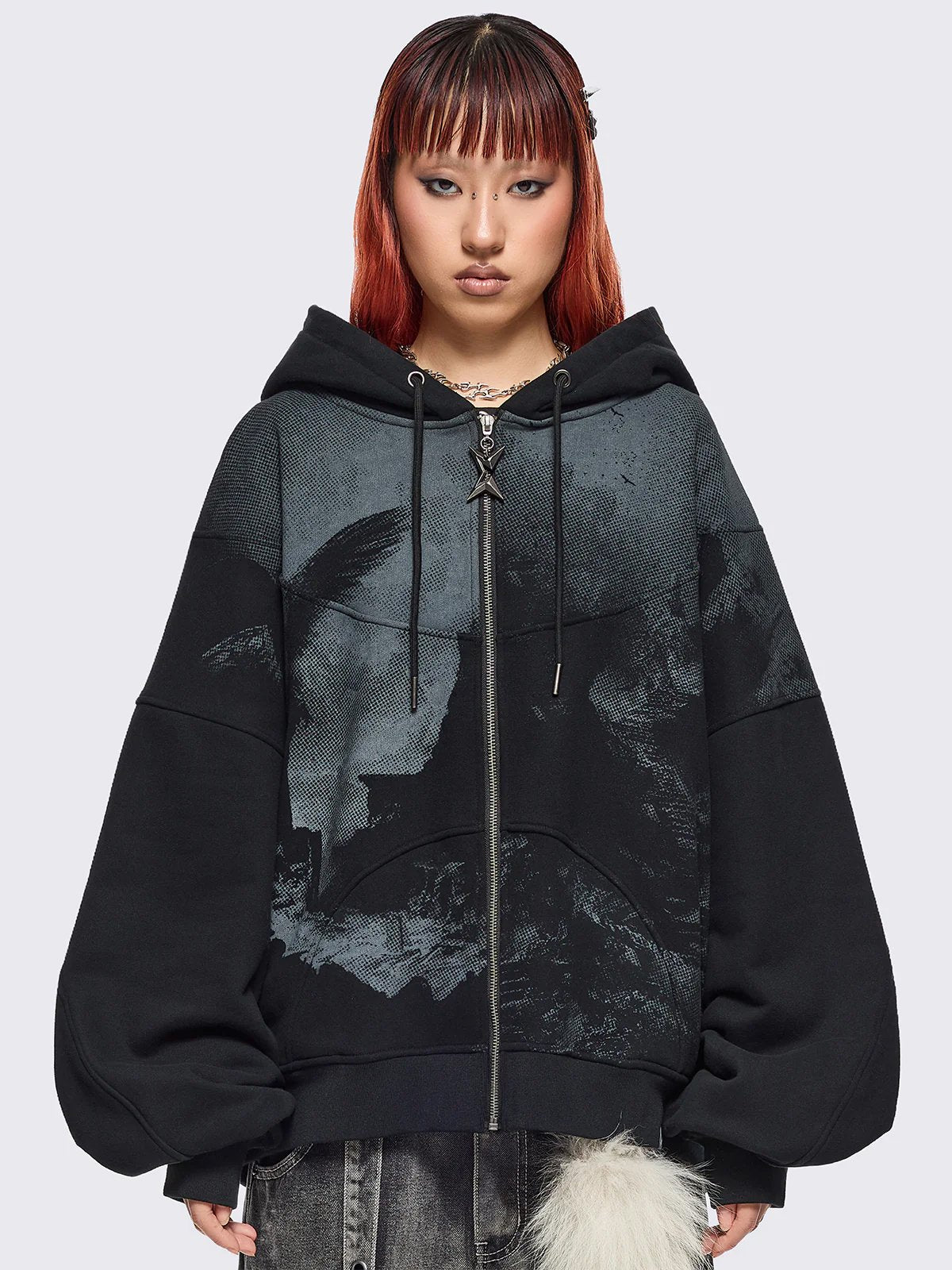 Black zip up hoodie jacket with grunge graphic print.