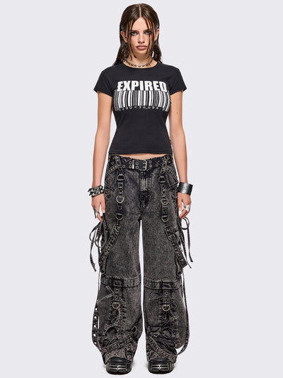 Grey acid washed multi pocket cargo jeans featuring a detachable-leg with zipper and all over strap, D-ring and lace up details.