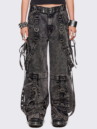 Grey acid washed multi pocket cargo jeans featuring a detachable-leg with zipper and all over strap, D-ring and lace up details.