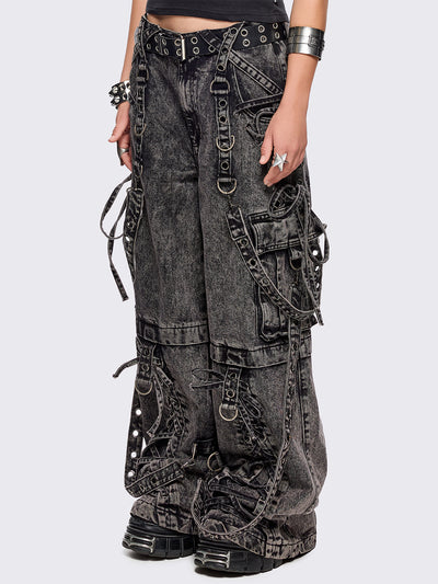 Grey acid washed multi pocket cargo jeans featuring a detachable-leg with zipper and all over strap, D-ring and lace up details.