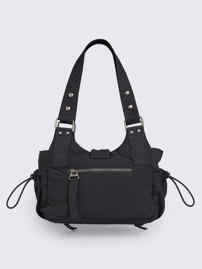 Black nylon multi pocket shoulder bag with metal hardware and lace up toggle details.