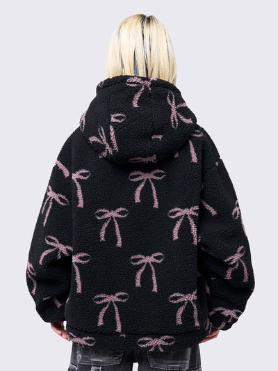 Black borg fleece hoodie jacket with an all-over pink bows design. Features an oversized fit and zip fastening.