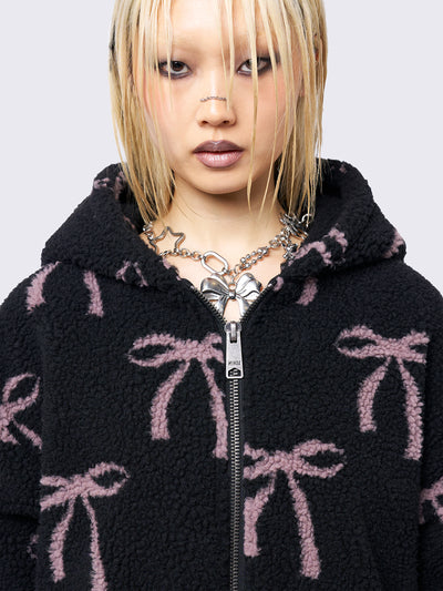 Black borg fleece hoodie jacket with an all-over pink bows design. Features an oversized fit and zip fastening.
