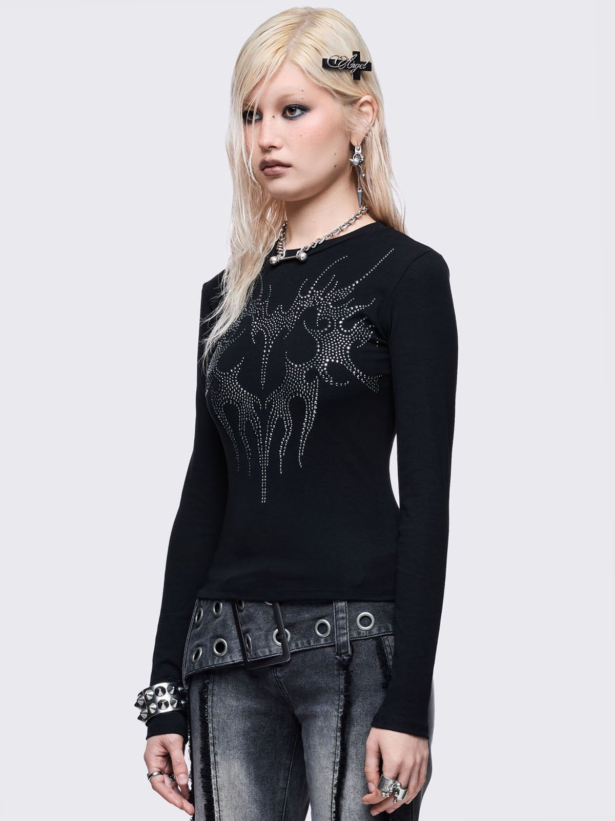 Black long sleeve top with sigilism heart rhinestone design.