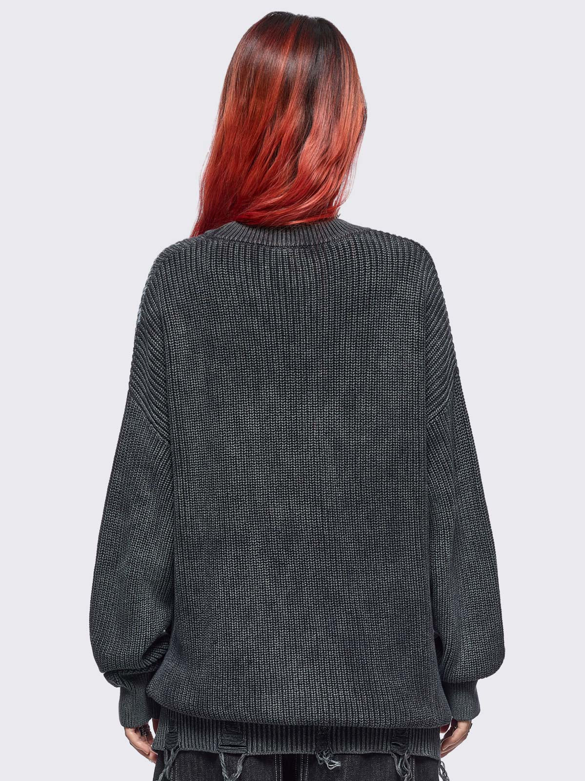 Black washed knit jumper in chunky ribbed knit with centipede graphic front print and distressed hem details. 
